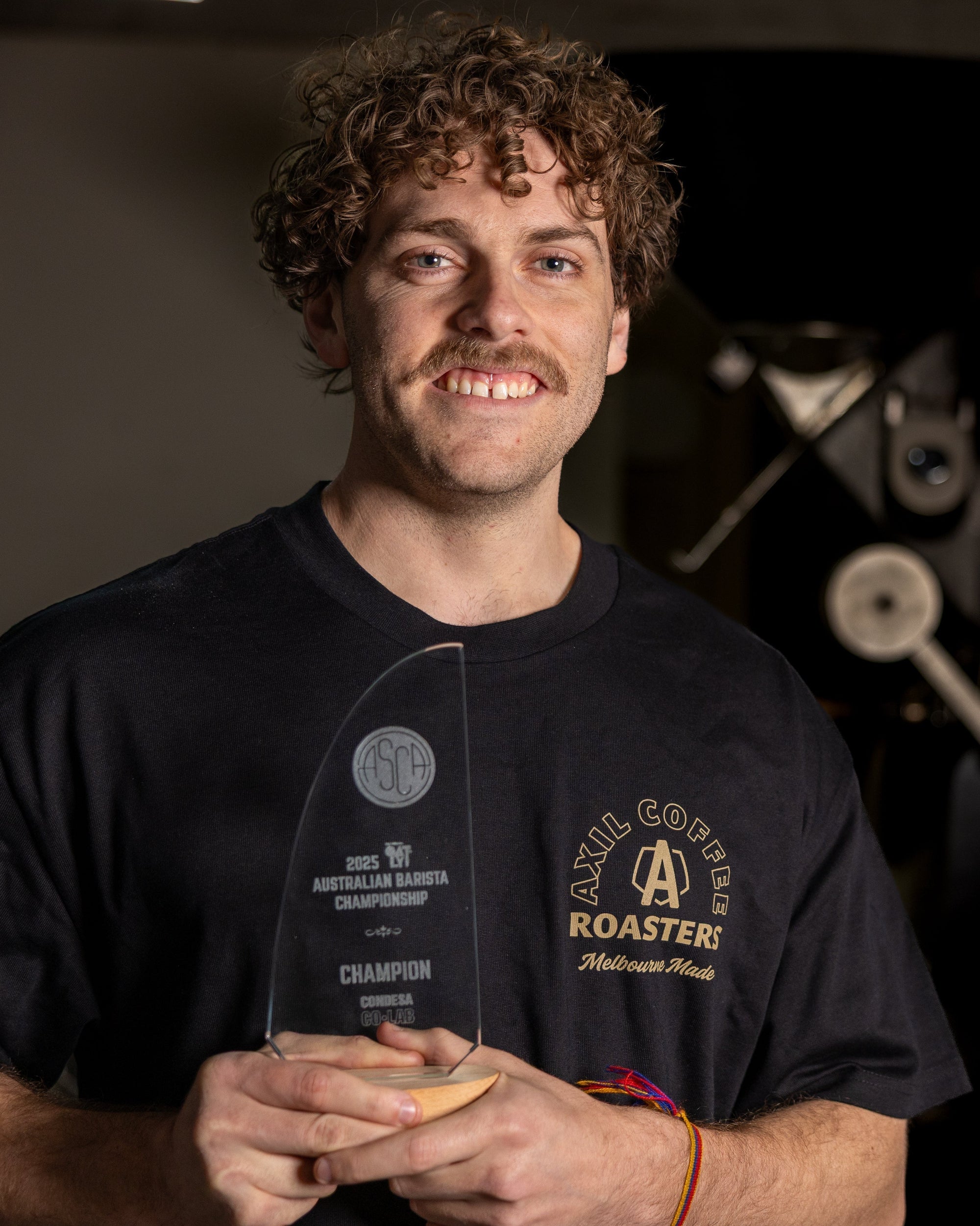 Jack Simpson holding Australian Barista Champion trophy 2025